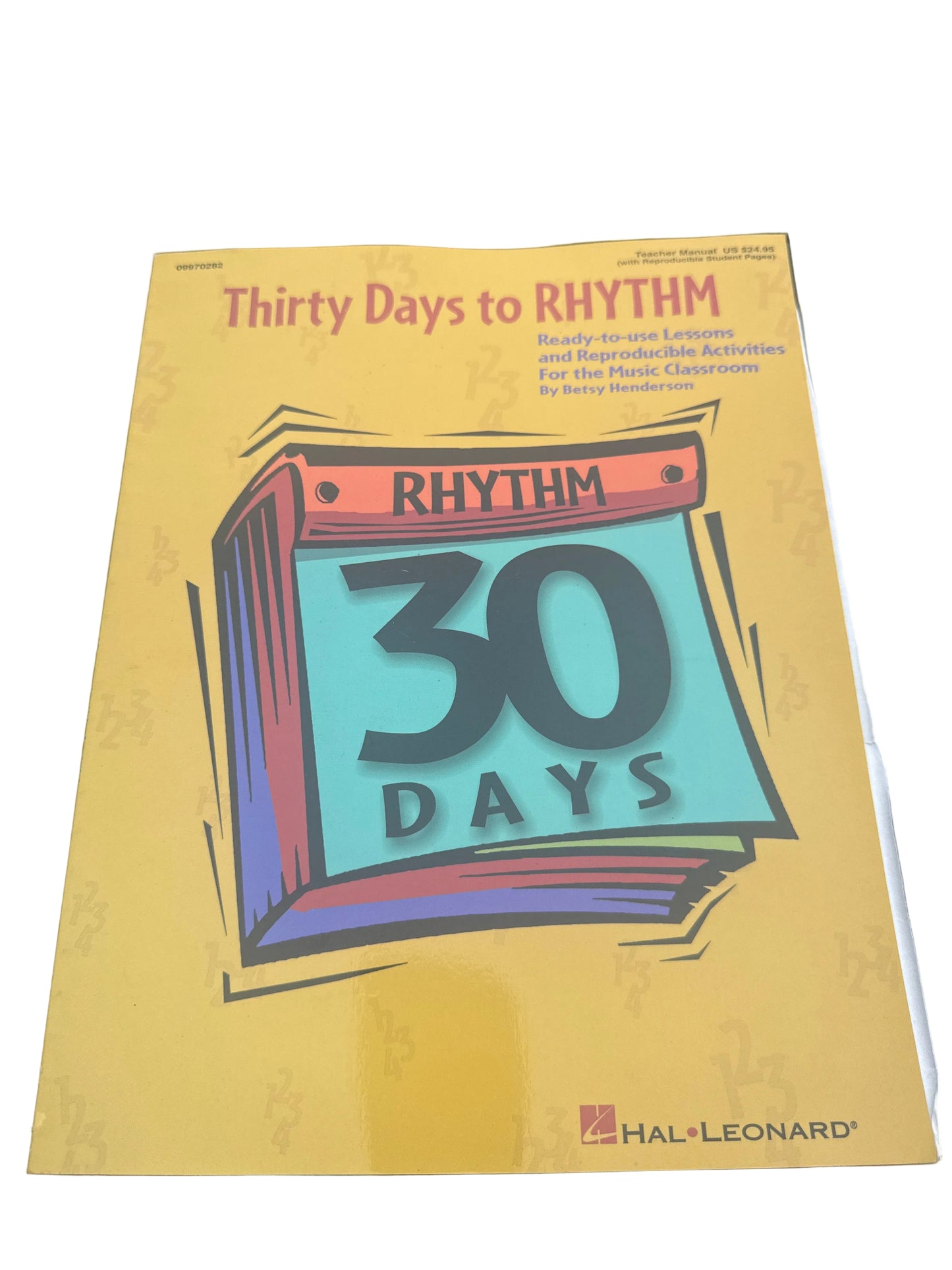 Book titled 'Thirty Days to Rhythm' by Hal Leonard on a black surface