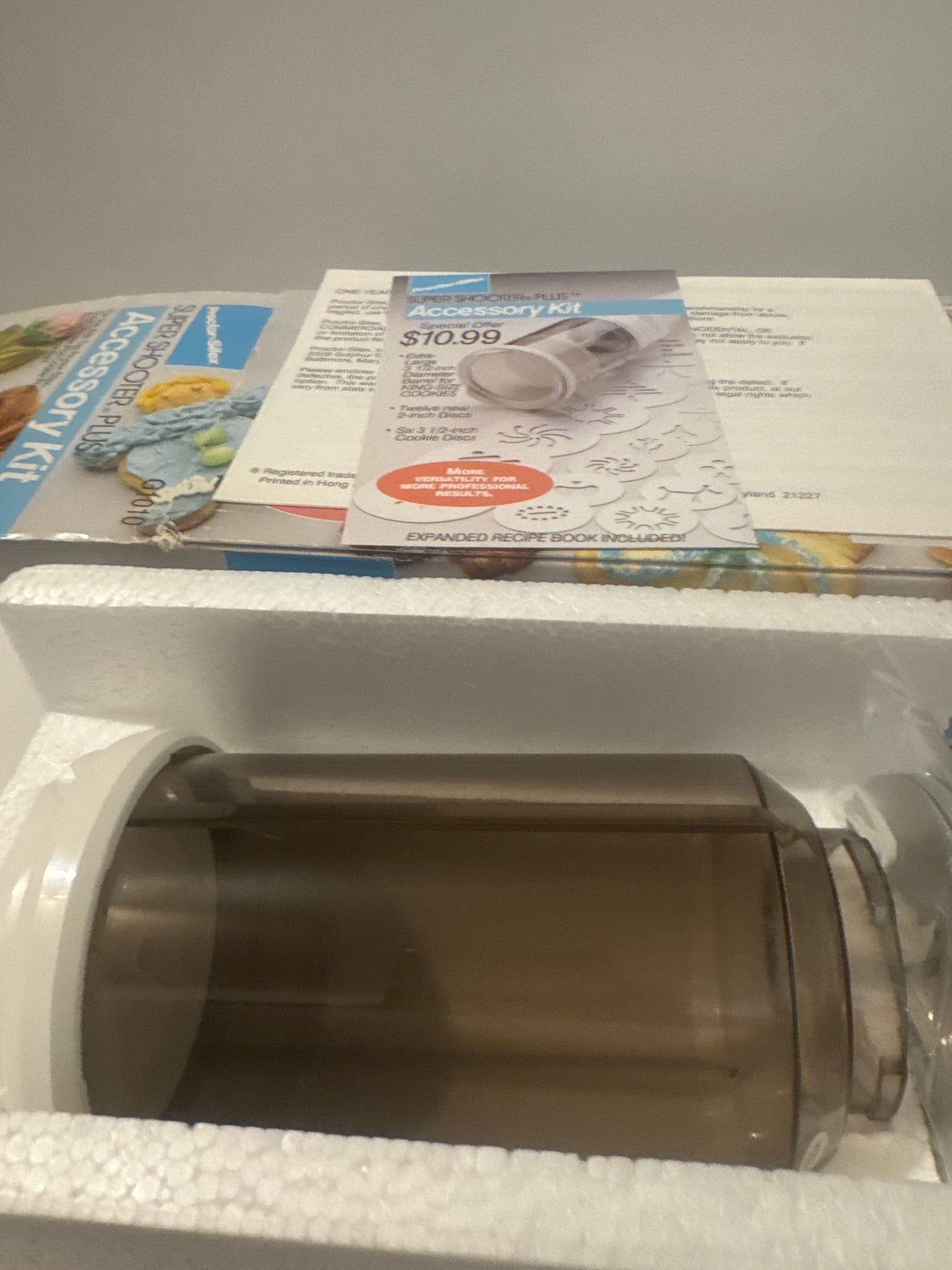 Complete Proctor Silex G1010 cookie press kit with attachments for creative home baking and cookie decorating.