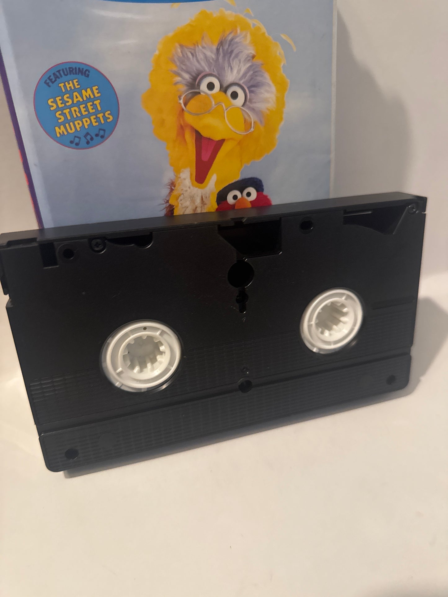 Elmo’s Musical Adventure VHS tape featuring Sesame Street characters on the cover