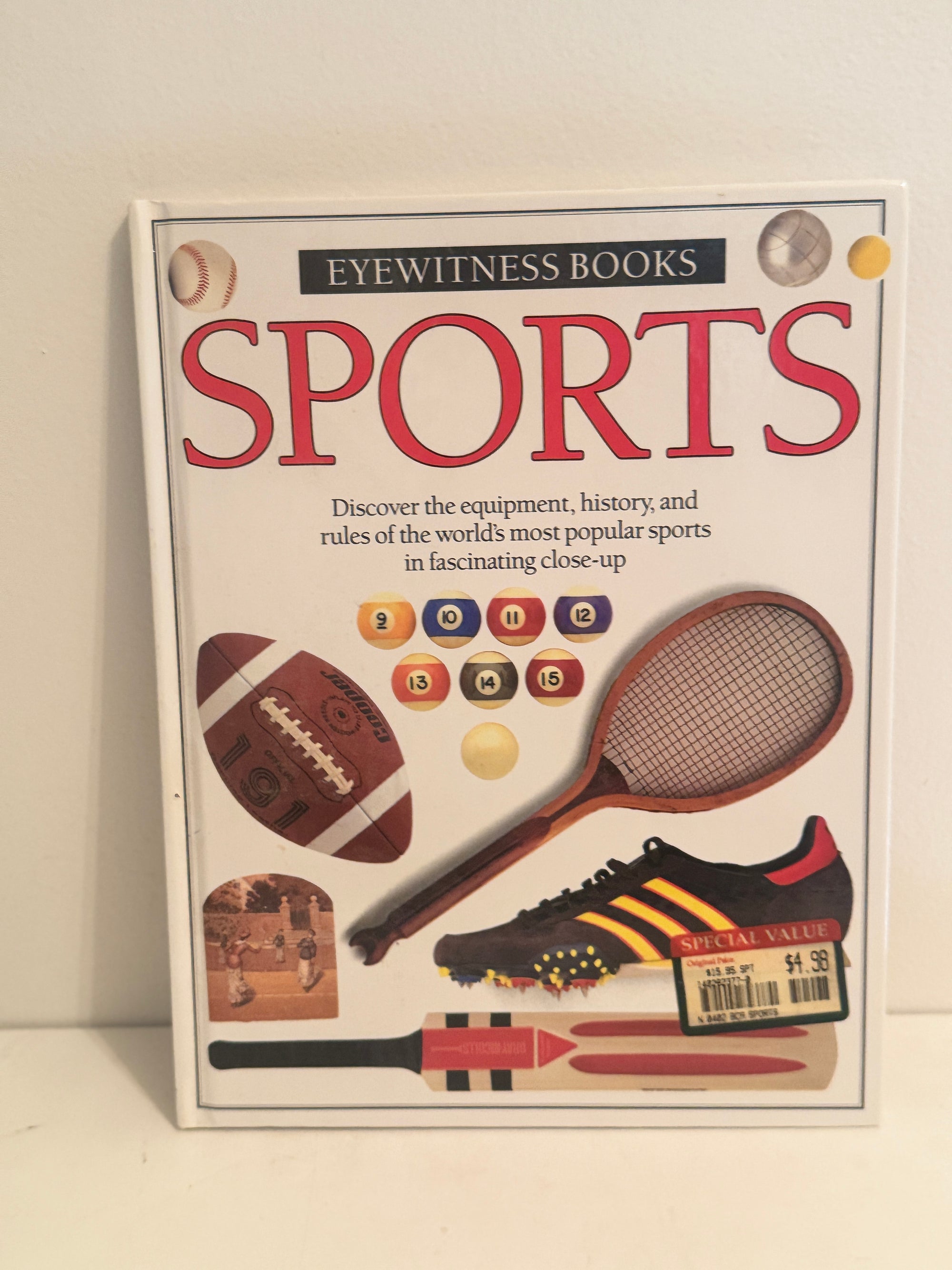 Eyewitness Books Sports edition with illustrations of football, tennis racket, cleat, and pool balls