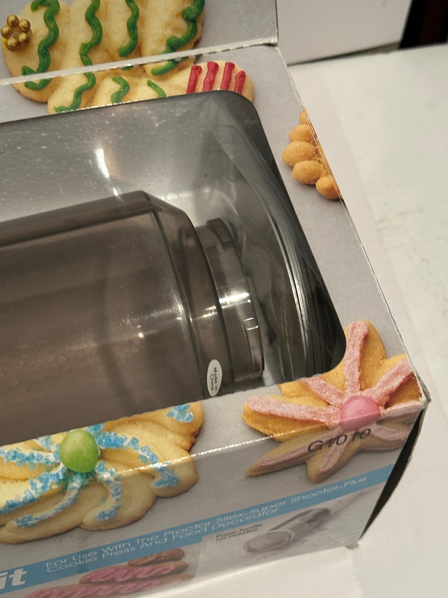 Proctor Silex shooter accessory kit in packaging with decorated cookies on the box