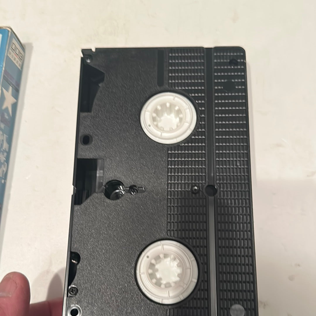 Close-up of Best of You Being Served VHS tape by EveryMailBox showing black plastic reels and casing