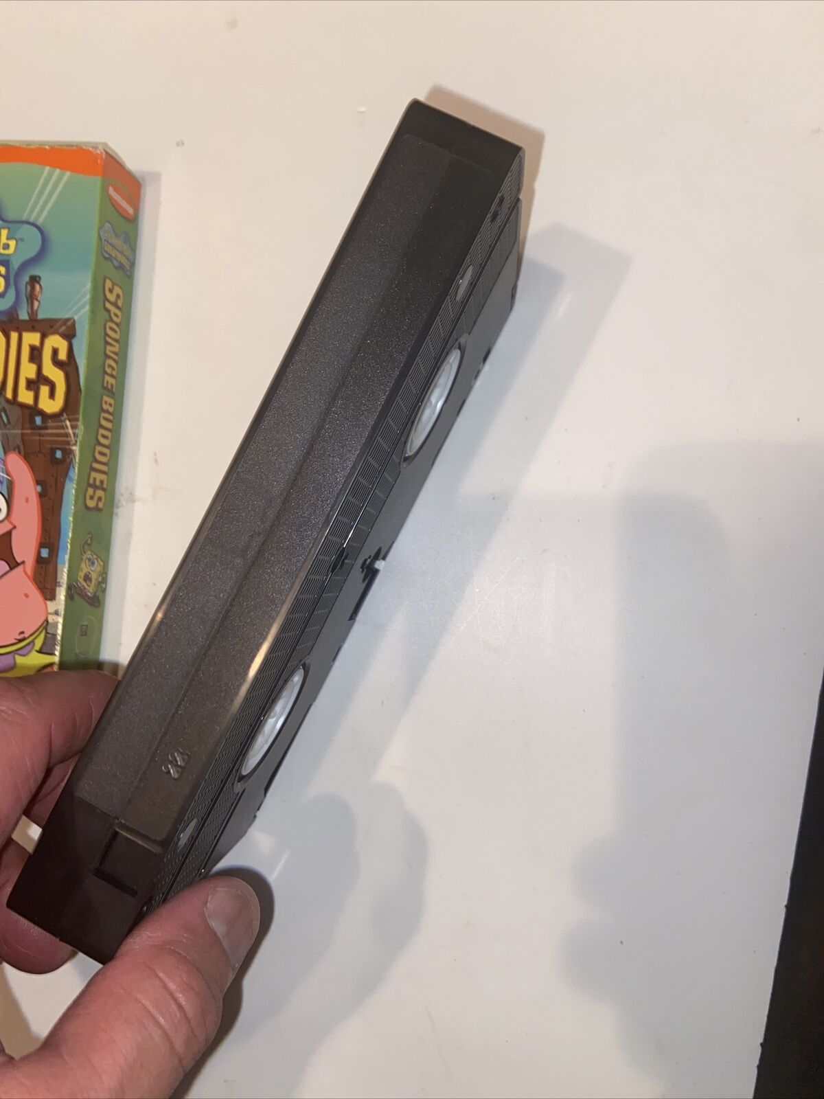 Spongebob Sponge Buddies VHS 2002 tape held in hand with partial original sleeve
