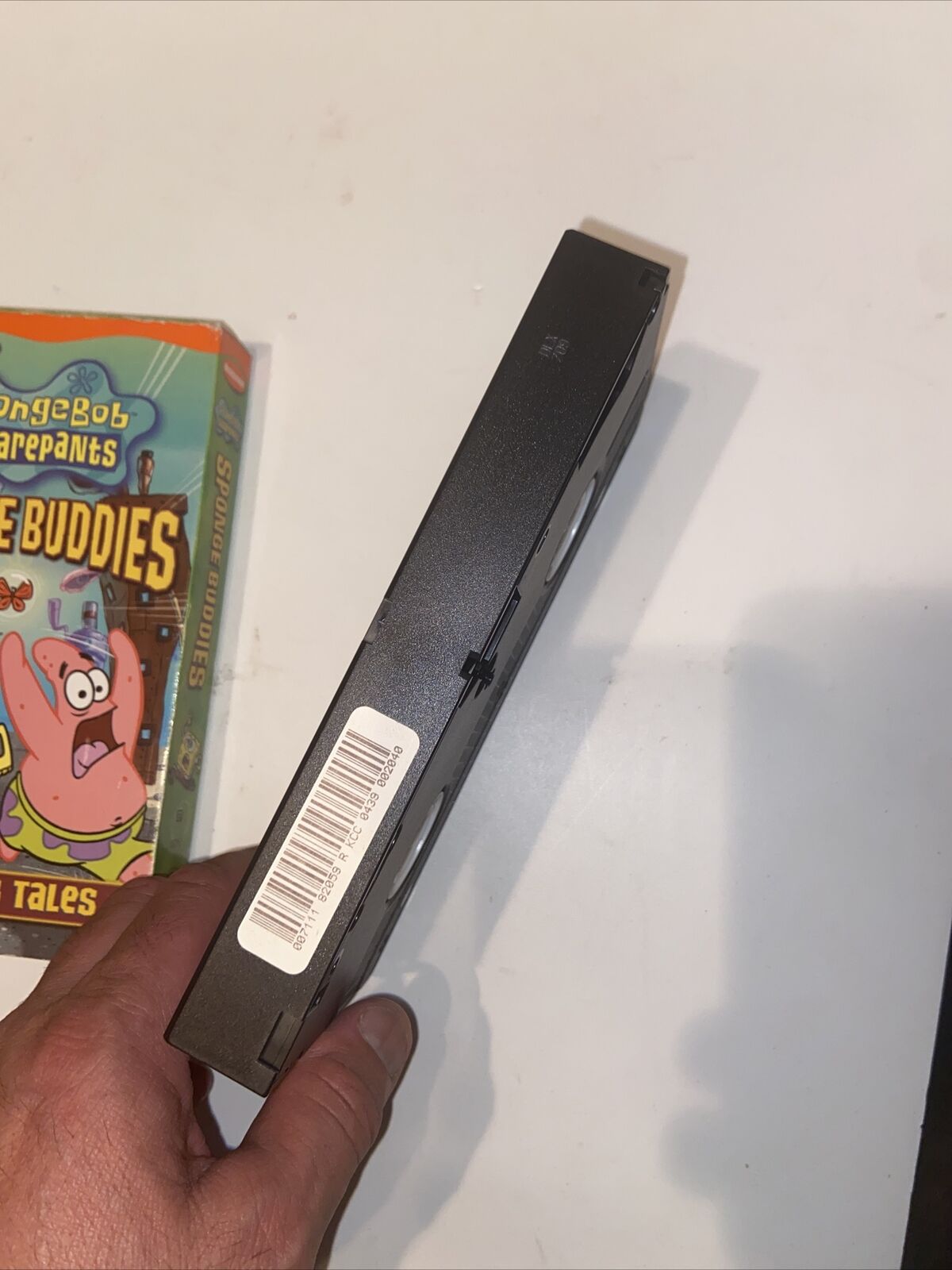 Spongebob Sponge Buddies VHS 2002 held in hand showing tape spine and partial box art