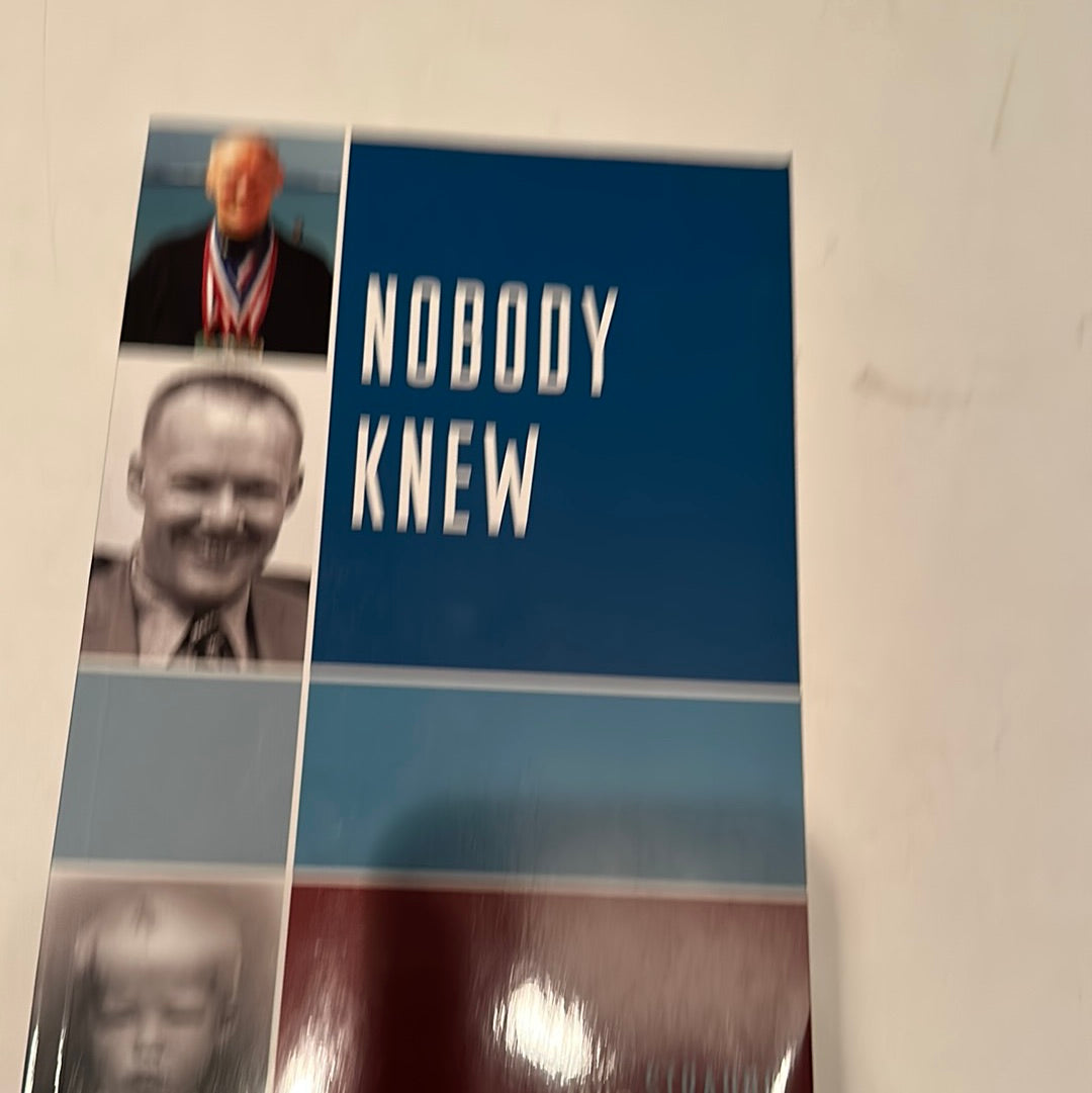 Nobody Knew book with a blue cover and vintage black and white photos on the front by EveryMailBox