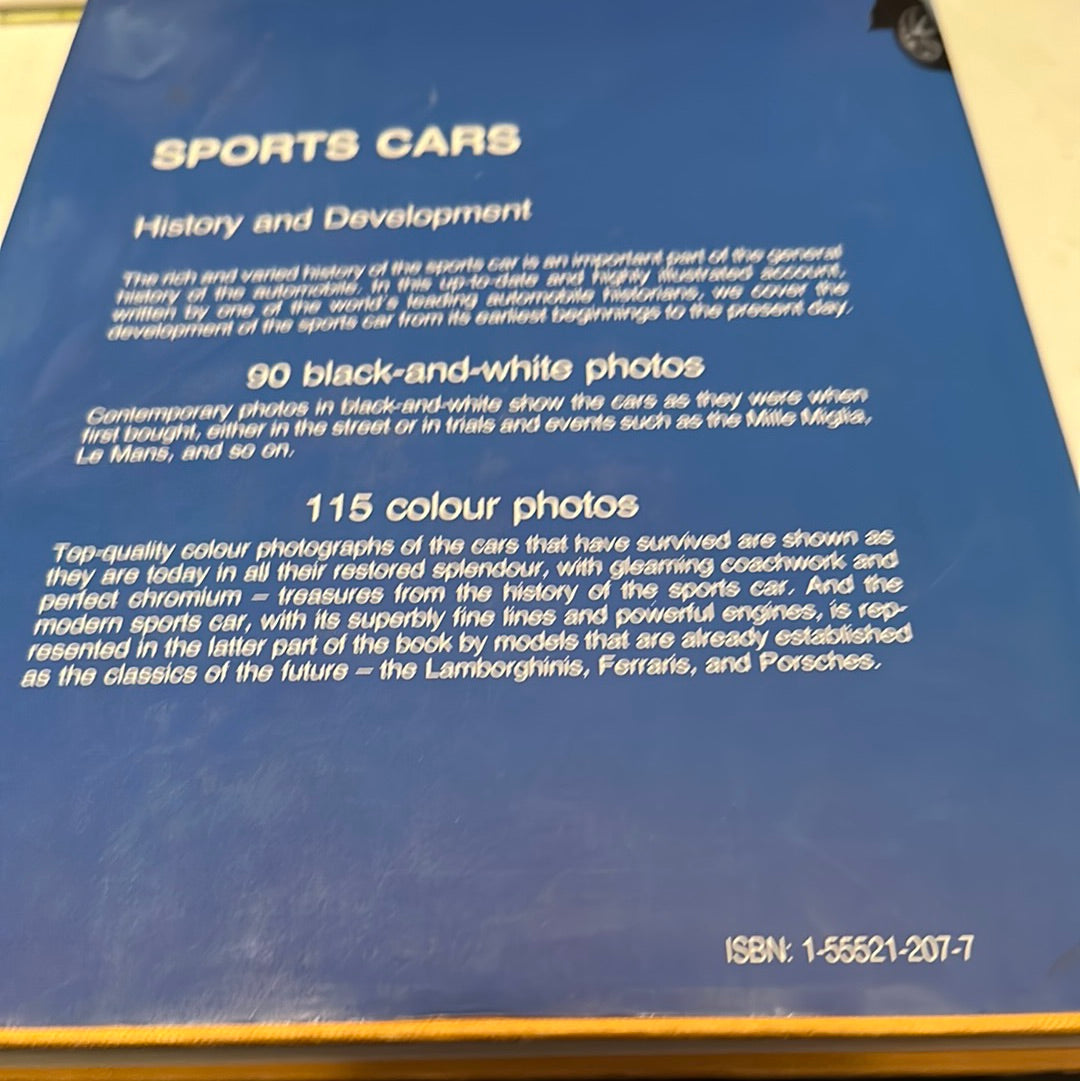 Back cover of a sports car collector guide book with text describing black-and-white and color photos of classic sports cars