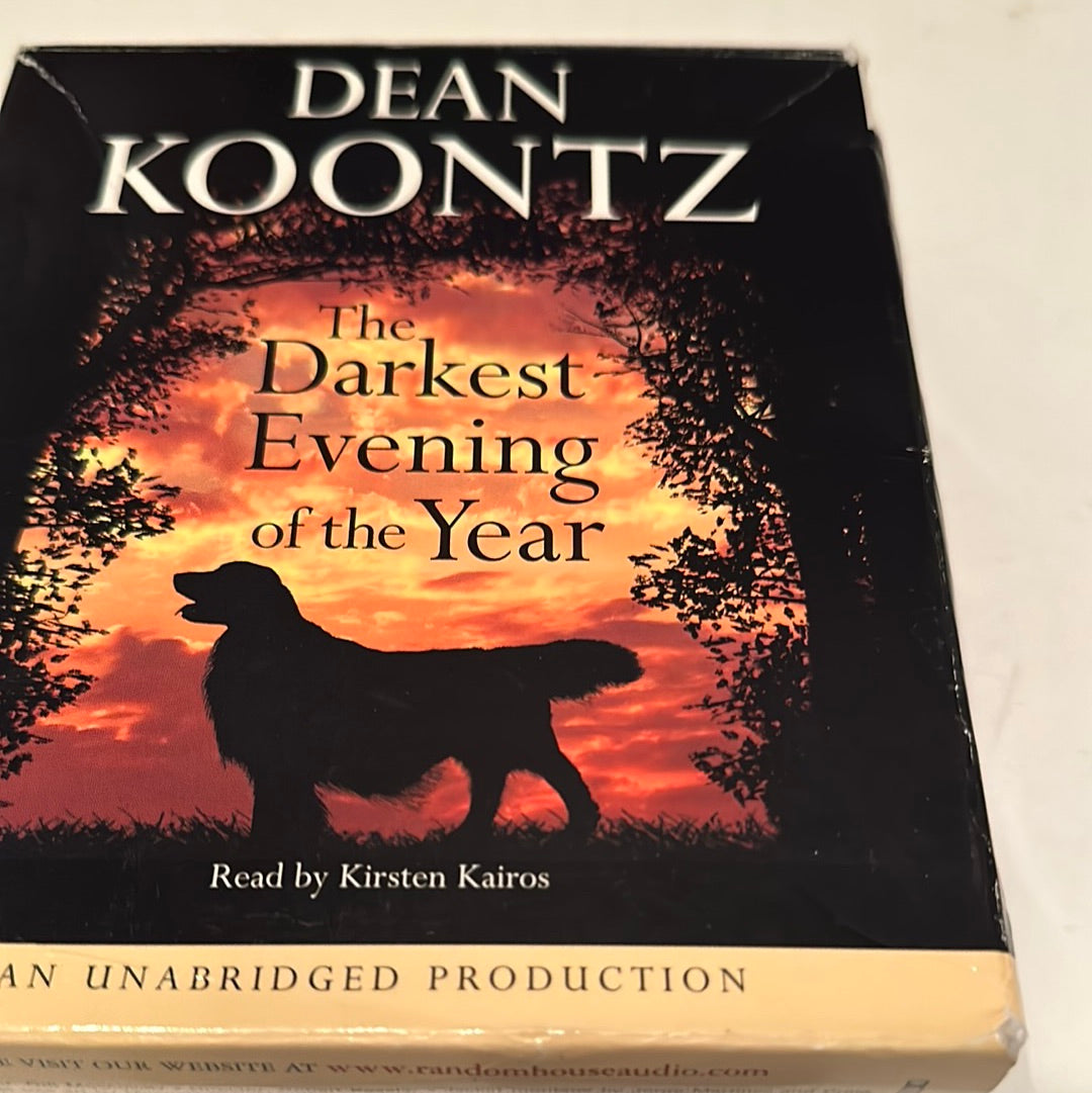 The Darkest Evening of the Year book by Dean Koontz with silhouette of a dog against a sunset background