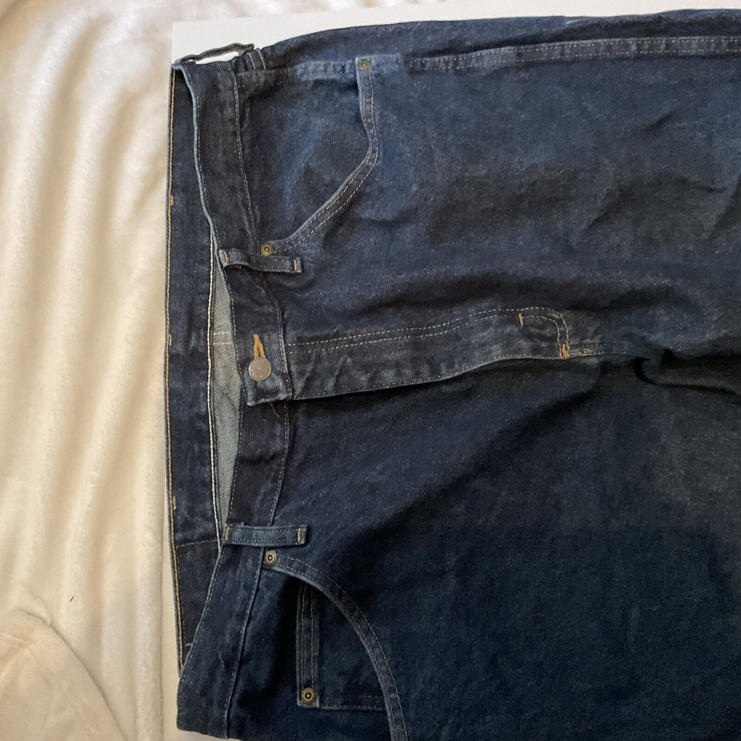Wrangler relaxed fit jeans men dark indigo front view with button waist belt loops and front pockets