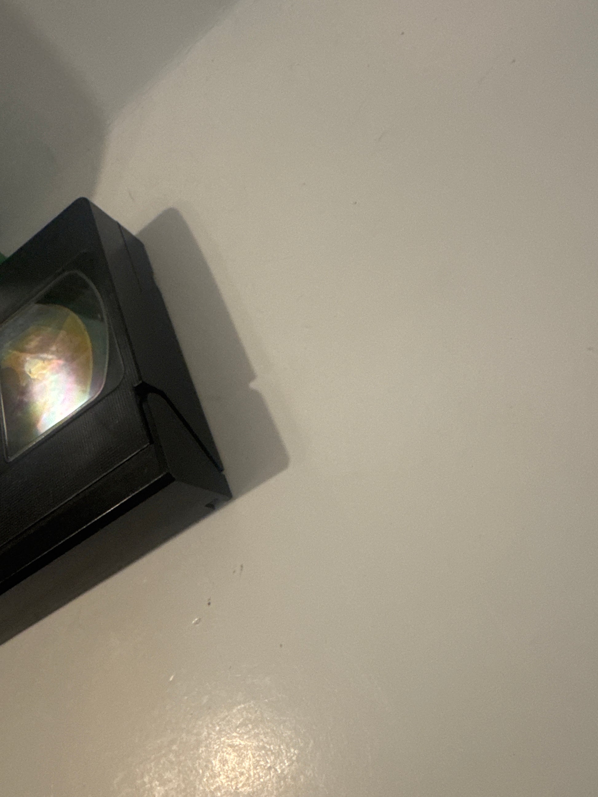 One Move to Better Golf VHS tape partially visible on white table showing clear label window