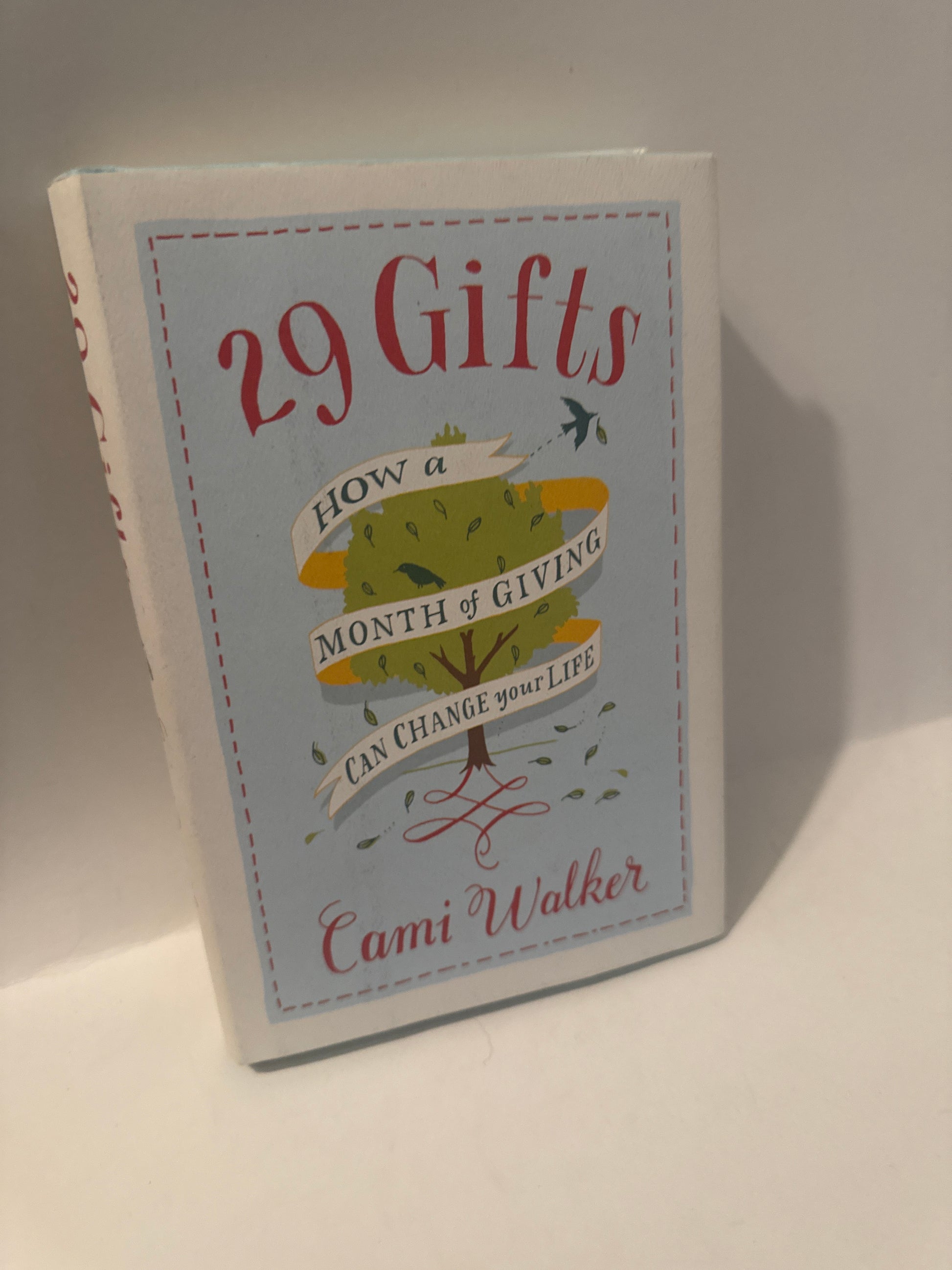 29 Gifts by Cami Walker book cover – tree with red ribbon – guide to emotional healing, generosity, and spiritual growth through daily acts of giving