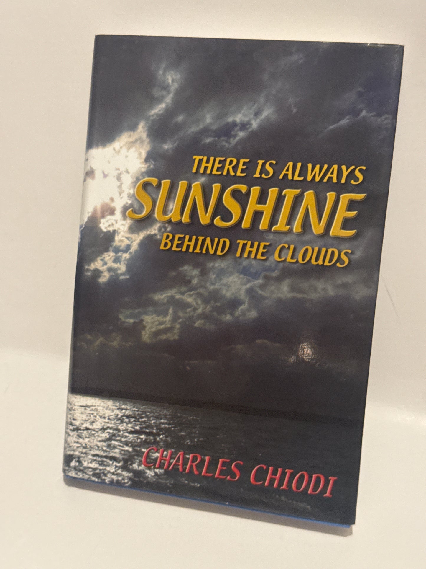 There Is Always Sunshine Behind the Clouds by Charles Chiodi - Hardcover