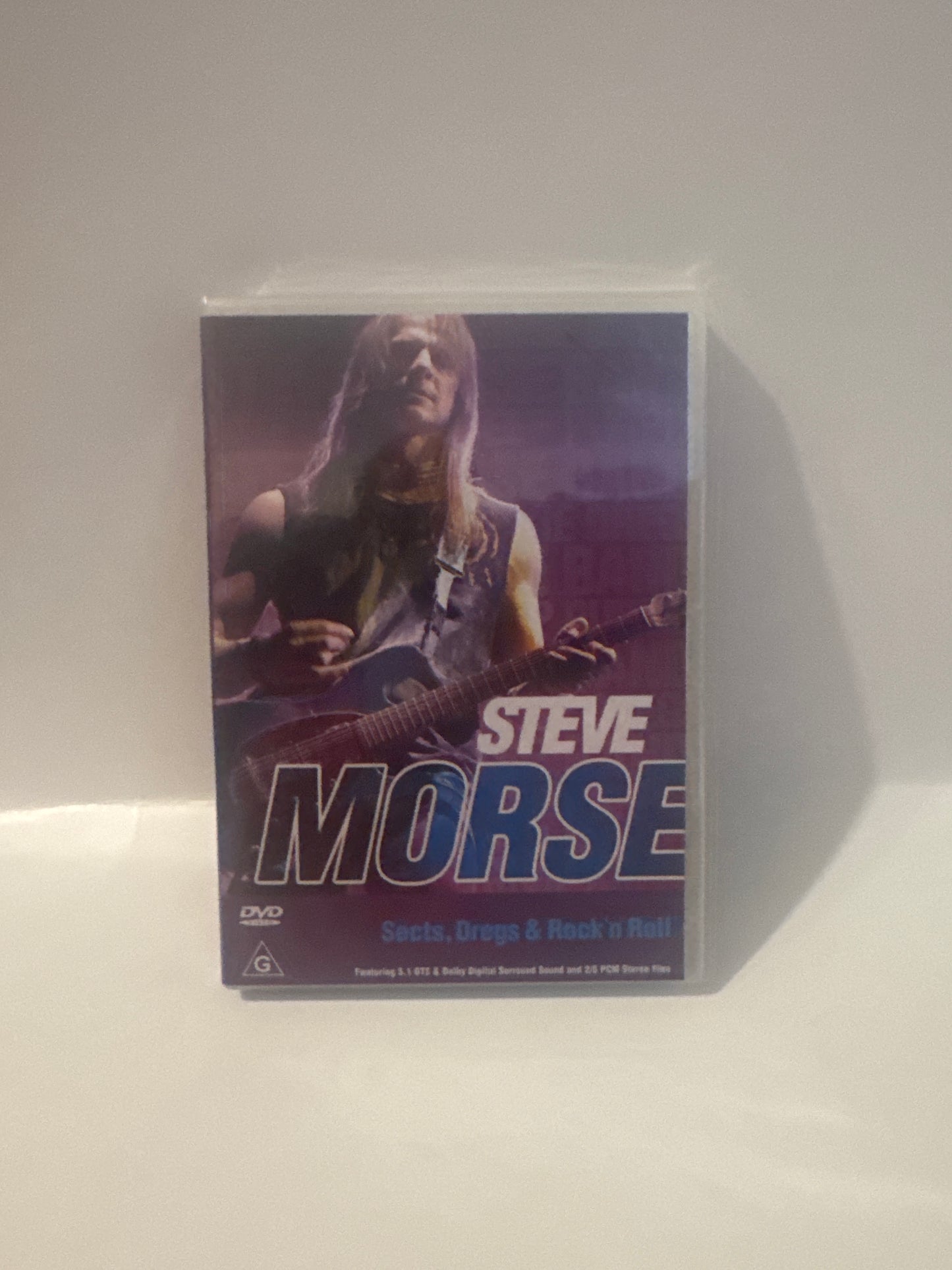  Front cover of Steve Morse’s “The Definitive Steve Morse” DVD featuring the guitarist mid-performance.