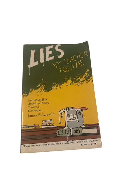 Book titled 'Lies My Teacher Told Me' on a white surface