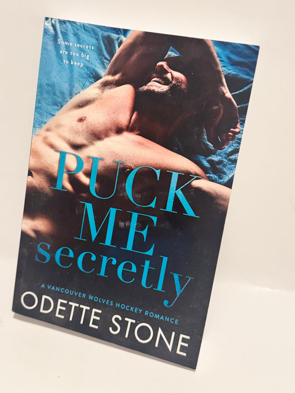 Puck Me Secretly - A Captivating Hockey Romance by Odette Stone
