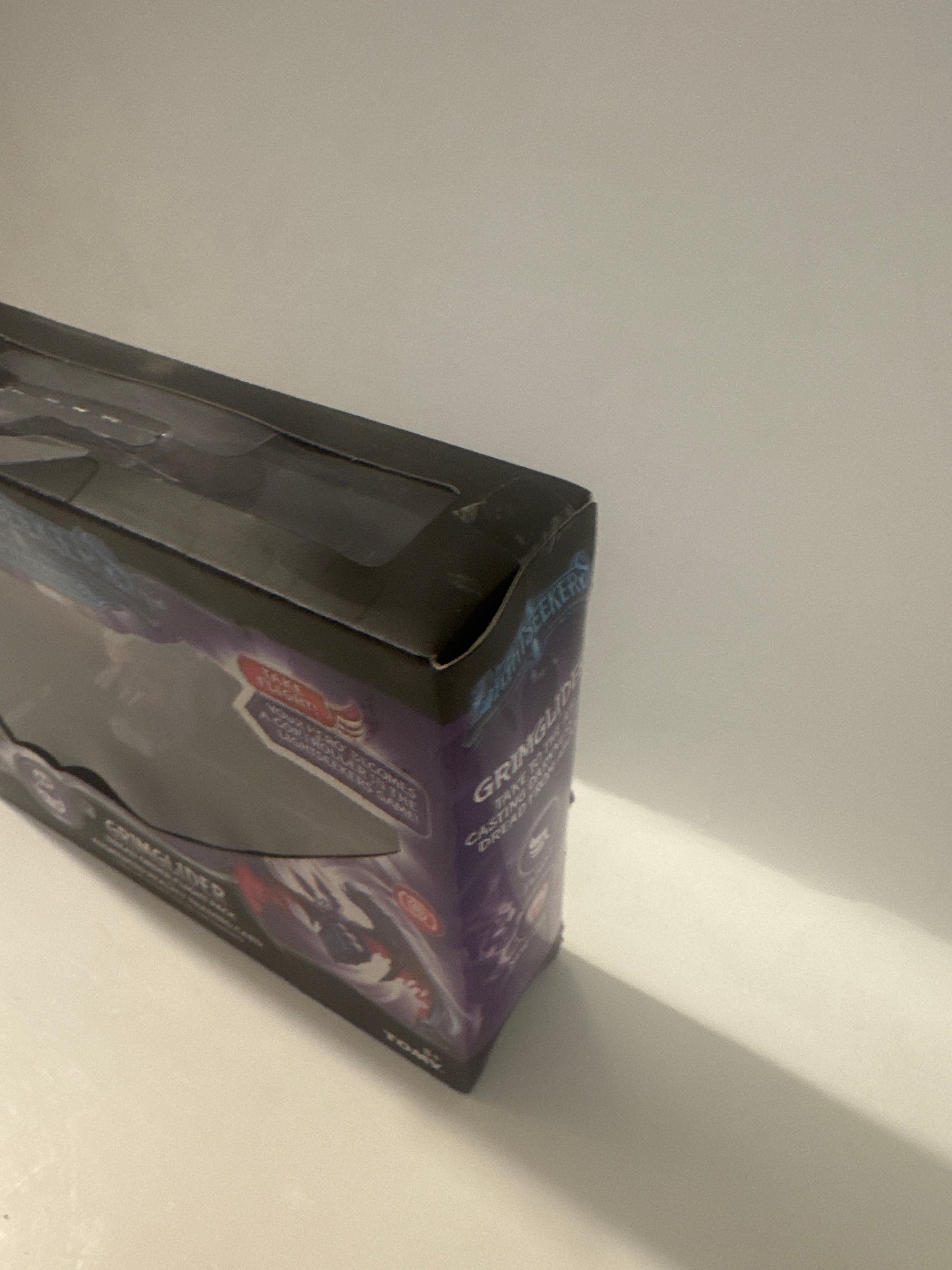 Grimglider Dread Order toy pack for ages 8+, includes AR trading card and branded by TOMY and Play Fusion.
