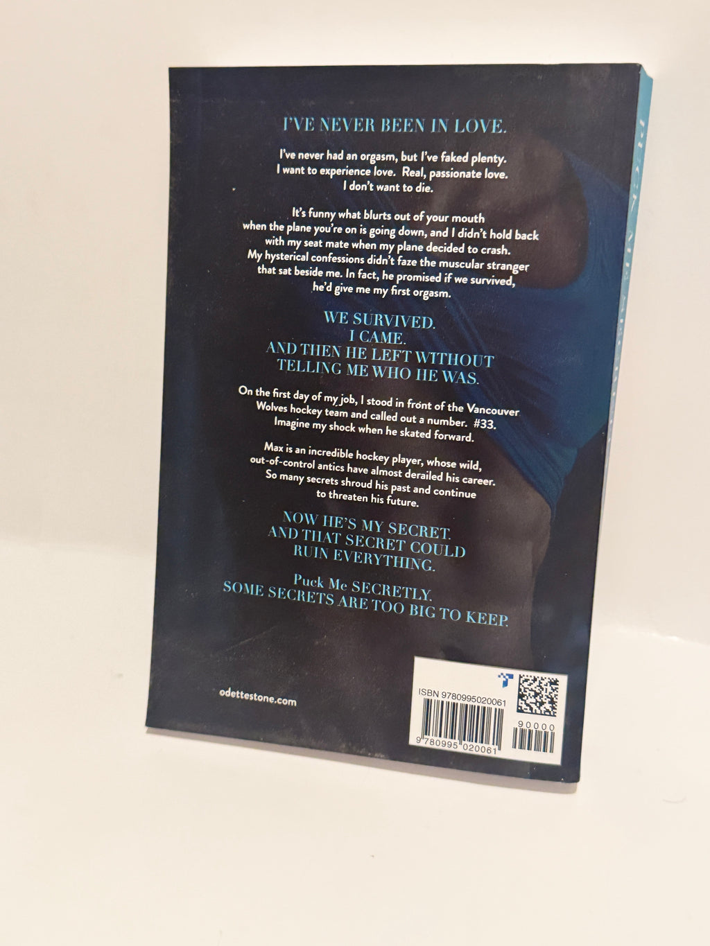 Puck Me Secretly - A Captivating Hockey Romance by Odette Stone