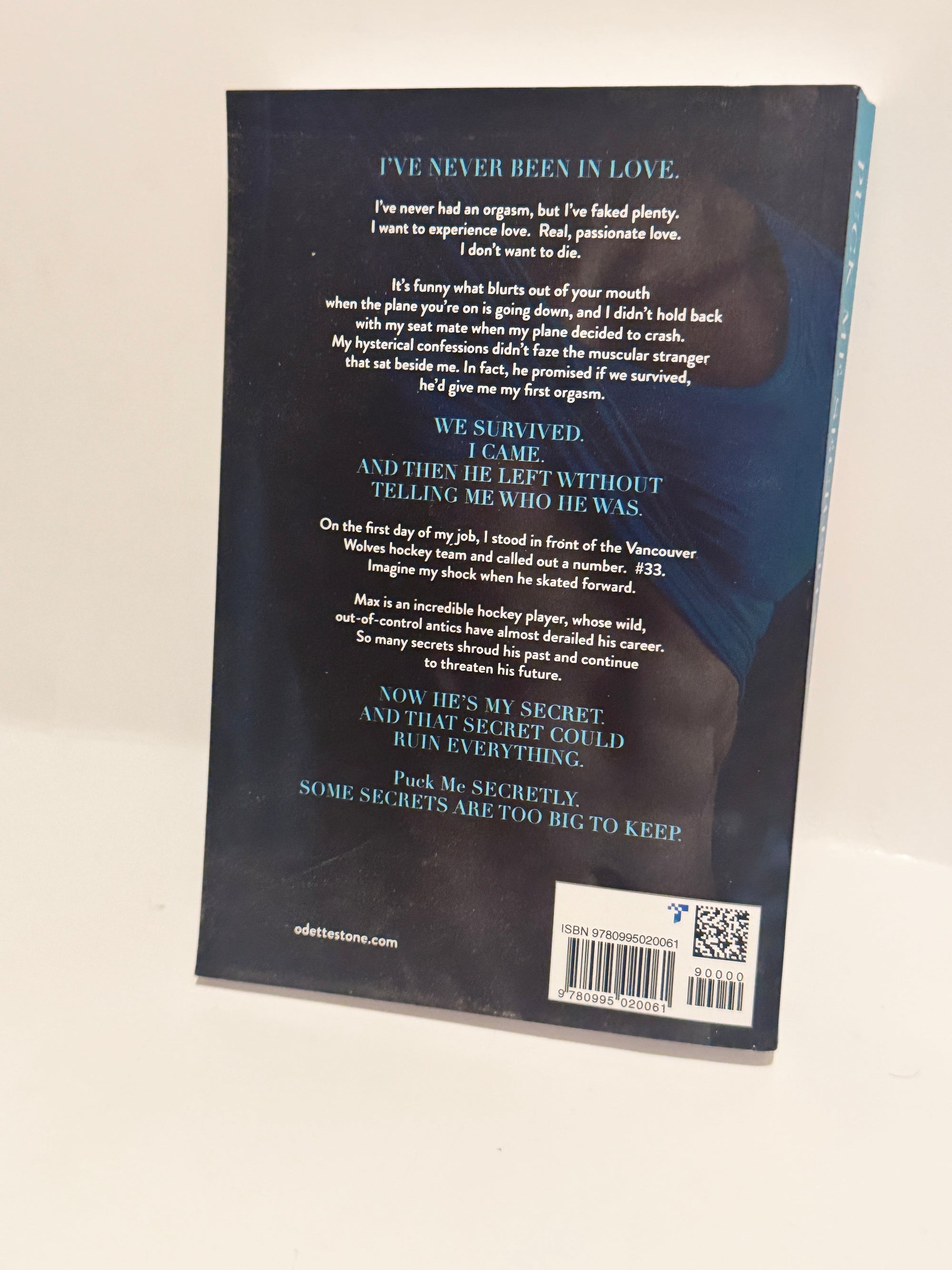 Puck Me Secretly - A Captivating Hockey Romance by Odette Stone