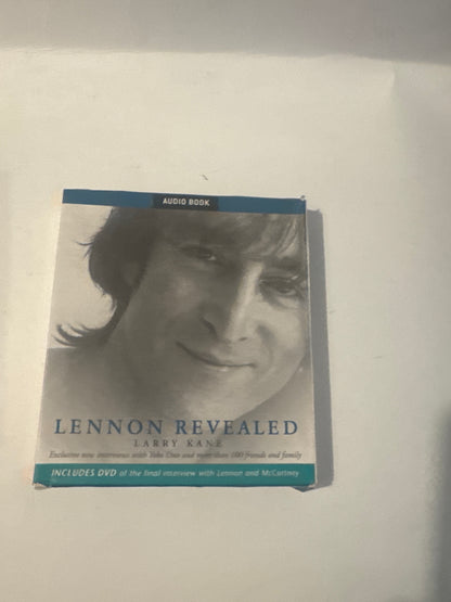 A boxed media product titled 'Lennon Revealed' with a grayscale portrait of John Lennon on the cover, photographed on a plain light background.