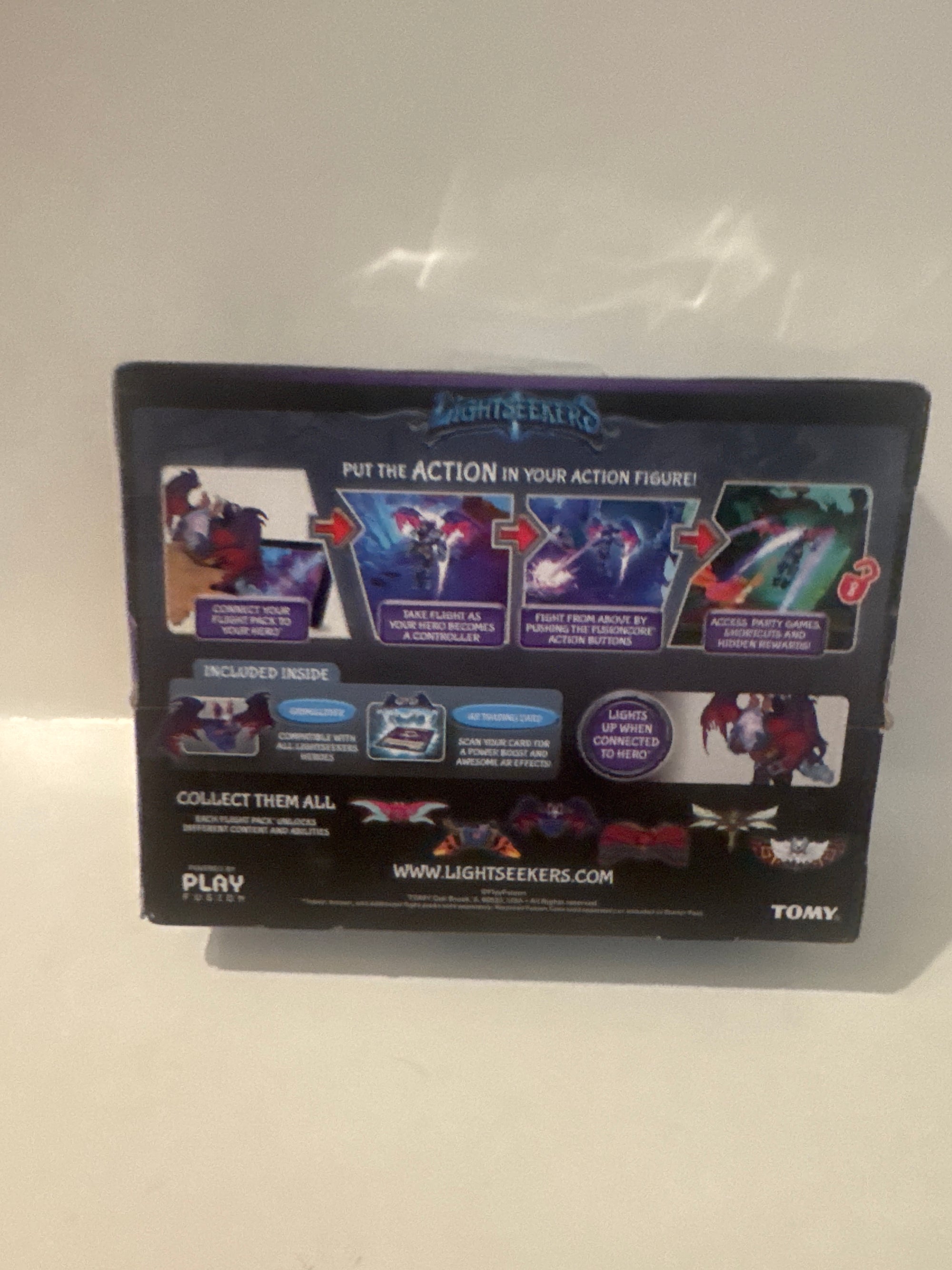 . Toy packaging for Lightseekers Awakening game accessory with tagline “Take Flight!” and augmented reality features.