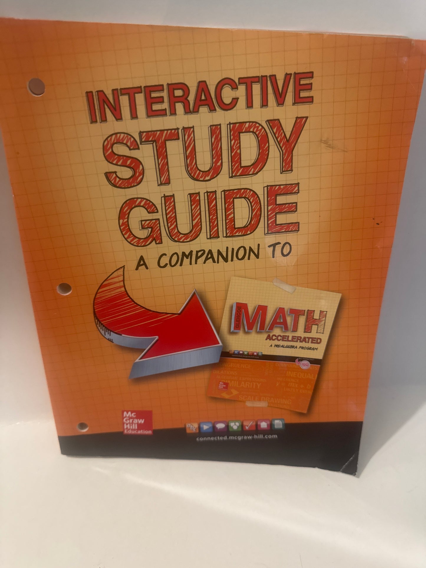 Interactive study guide with a math book on top, on a white surface