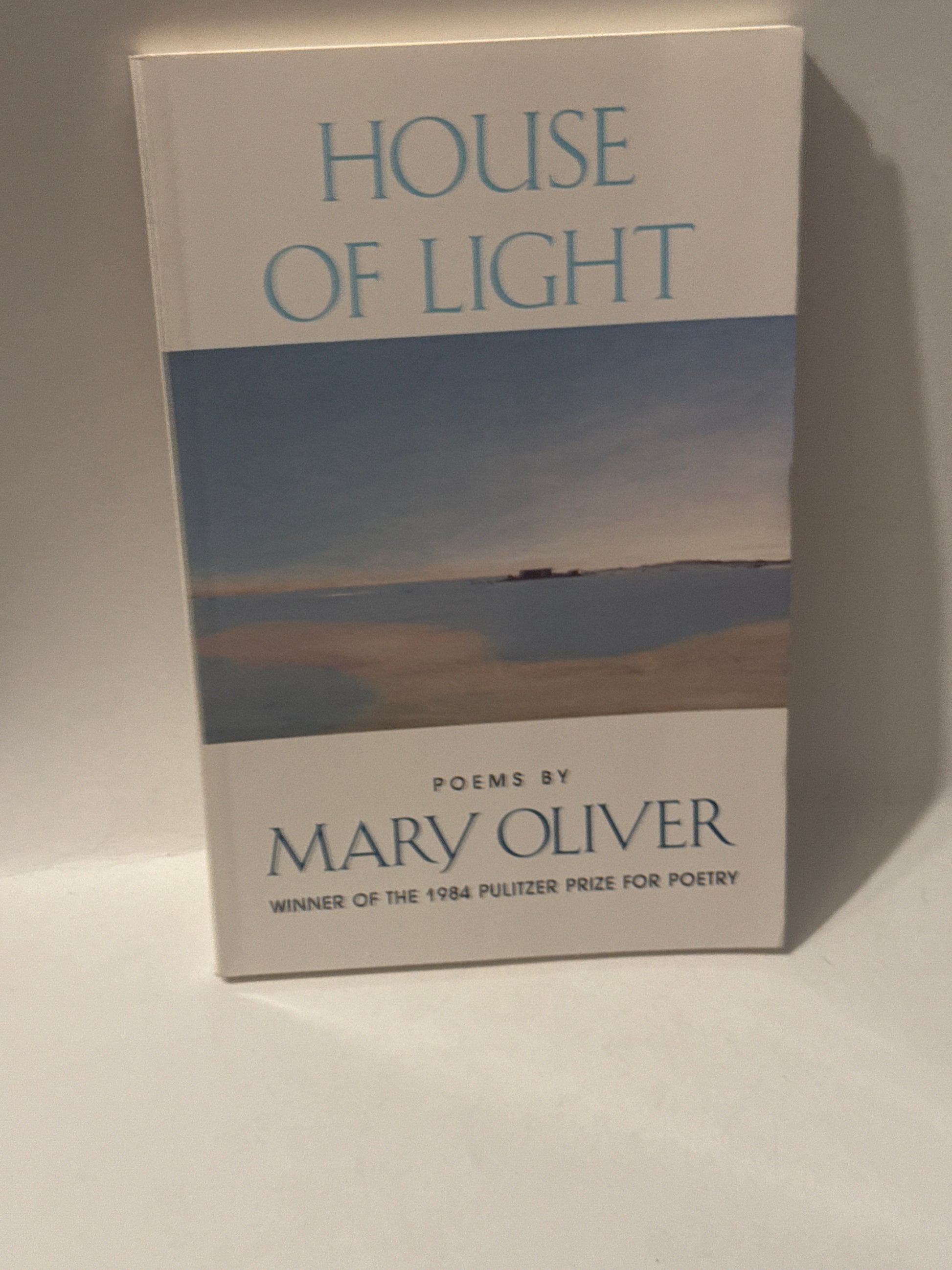 Front cover of House of Light by Mary Oliver, featuring soft natural tones and elegant typography.