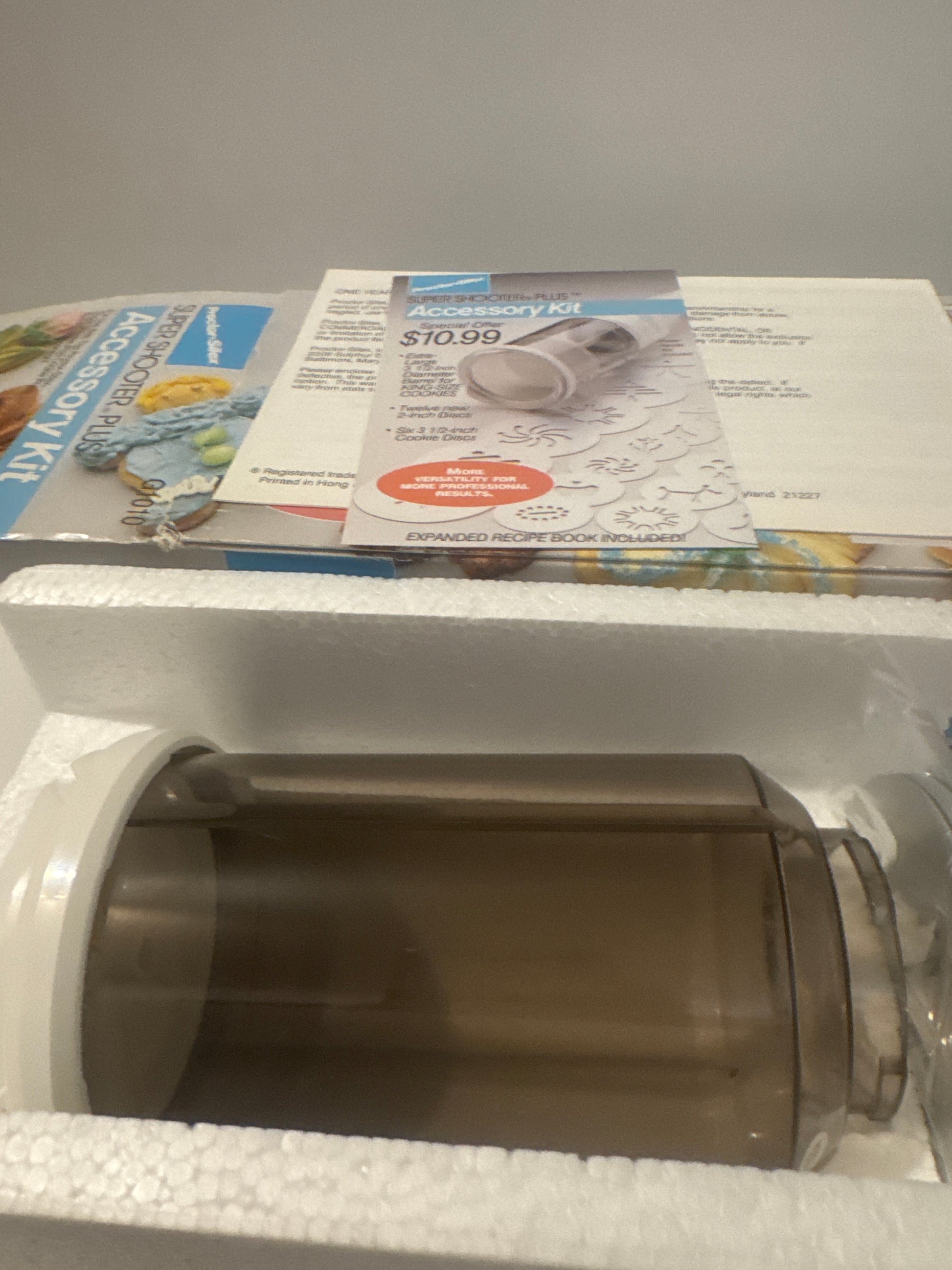 Complete Proctor Silex G1010 cookie press kit with attachments for creative home baking and cookie decorating.