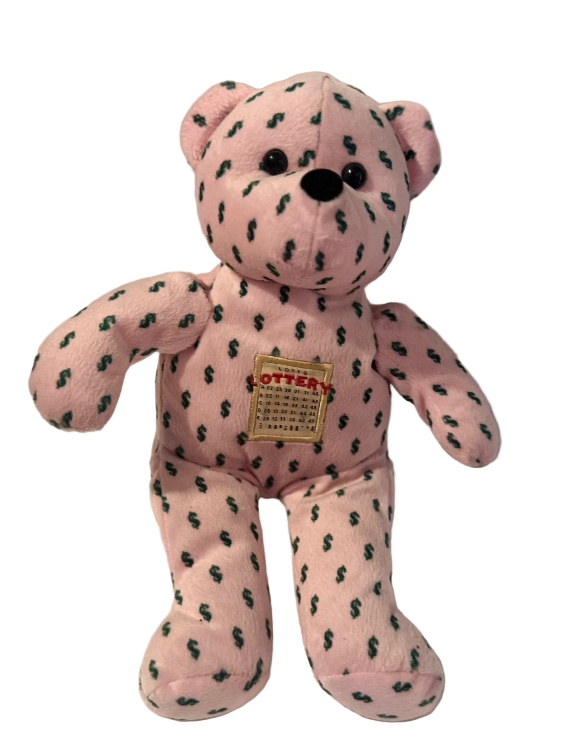 Pink teddy bear with black paw prints on a white background