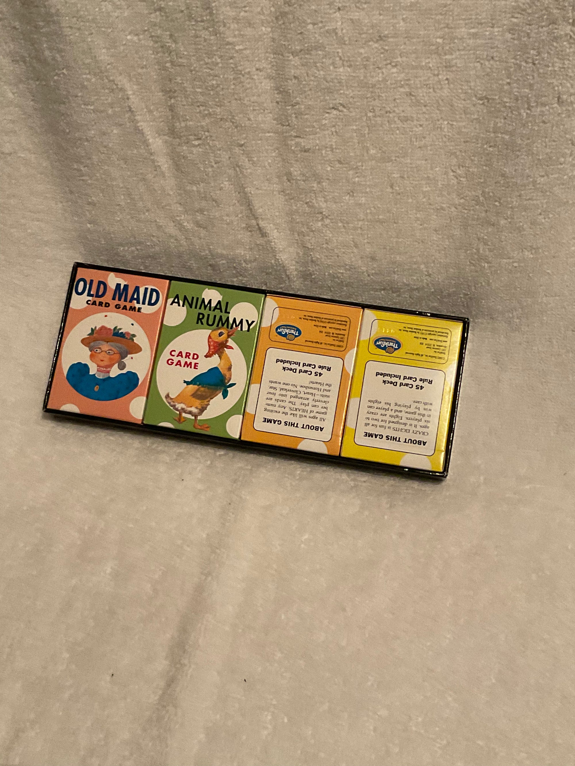 ThinkFun card games set featuring Old Maid and Animal Rummy vintage style card games in a compact box