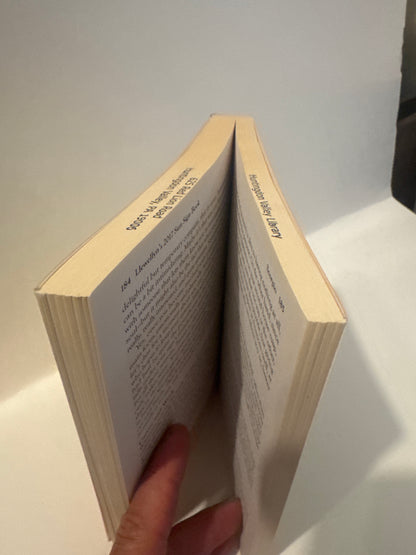 EveryMailBox paperback book held open by hand showing inner pages and spine horoscope guide for love money and success