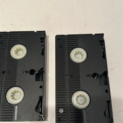 Two black VHS tapes from the Basil Rathbone VHS collection by EveryMailBox on white background