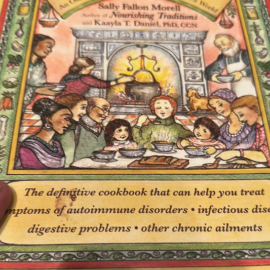 Cookbook cover featuring a family enjoying easy healthy broth for autoimmune support by the fireplace