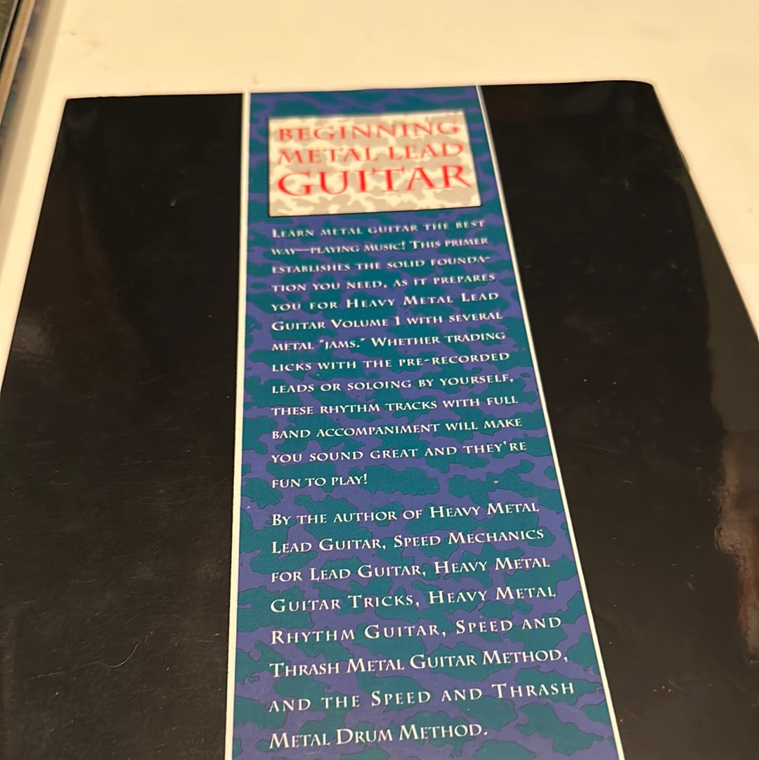 Beginning metal lead guitar book by EveryMailBox with instructional text on learning heavy metal lead guitar techniques