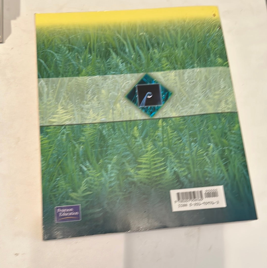 Back cover of EveryMailBox microeconomics study guide featuring a green and yellow grass design with an ISBN barcode