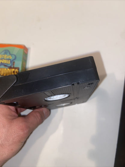 Hand holding black VHS tape with visible Spongebob Sponge Buddies VHS 2002 box art by EveryMailBox