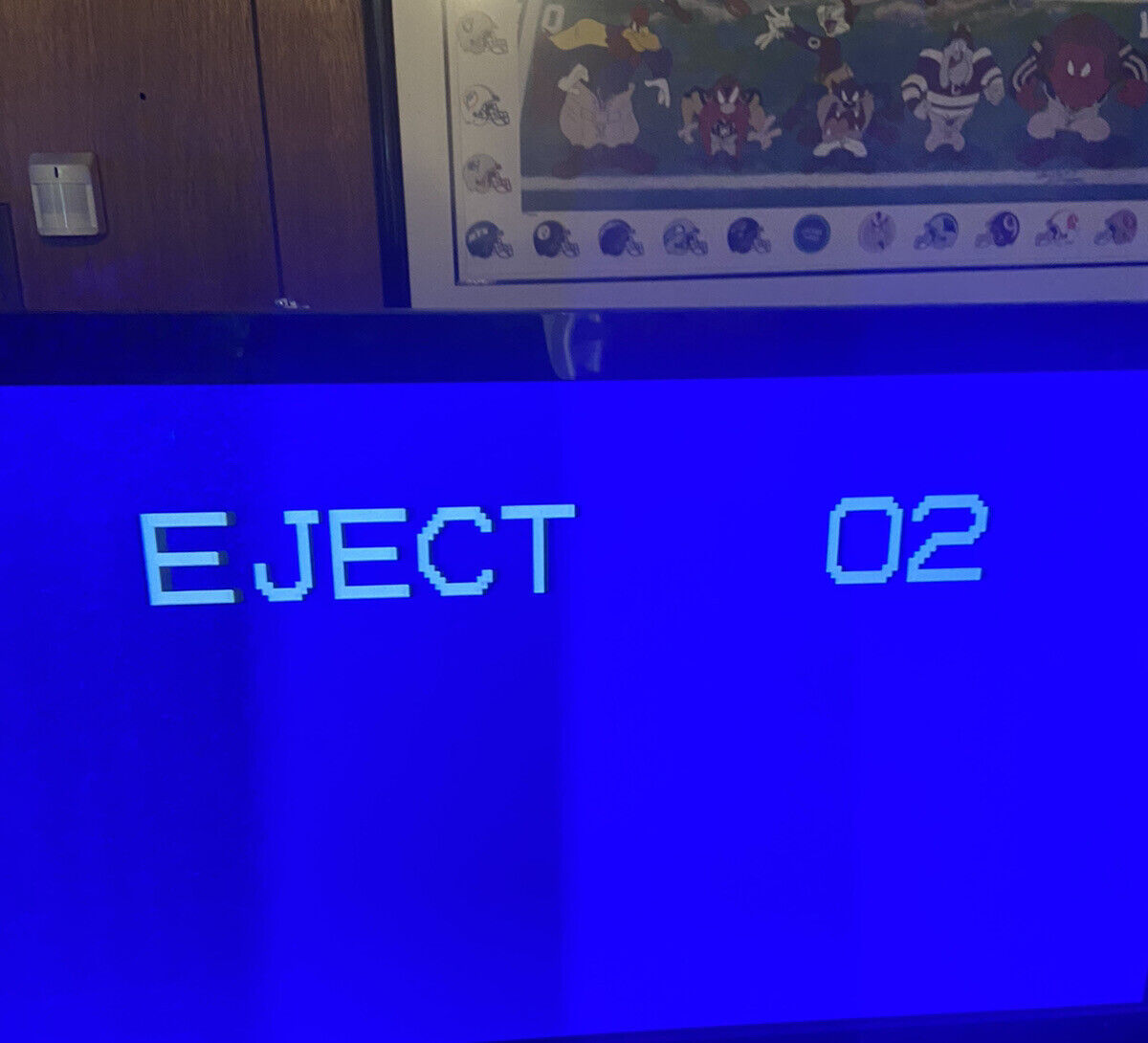 Panasonic OmniVision VHS player blue on screen display showing EJECT 02 message on vintage TV setup