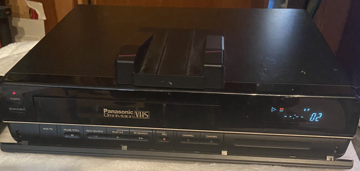 Vintage black Panasonic OmniVision VHS player top loading VCR with front LED display and control buttons