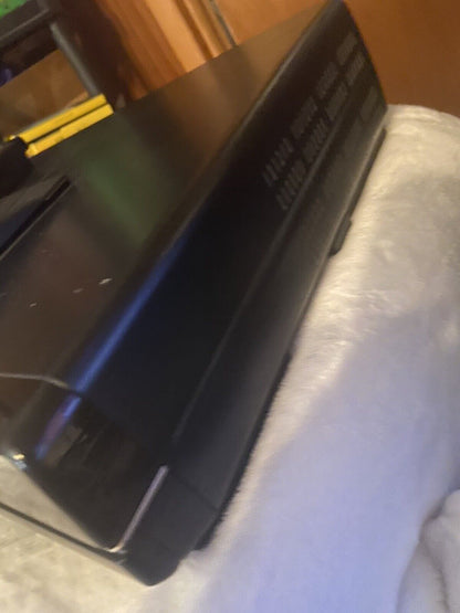 Panasonic OmniVision VHS player black vintage VCR front panel angled view showing buttons and display