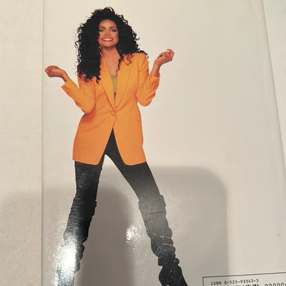 Cover of a rare La Toya Jackson book showing La Toya in an orange blazer and black pants