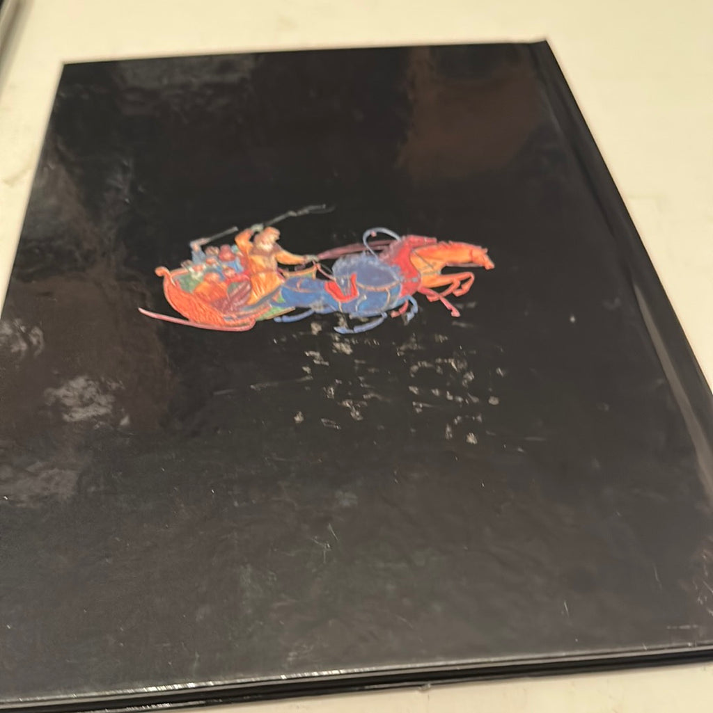 Black hardcover Russian Christmas history book with colorful sleigh and horses illustration on cover