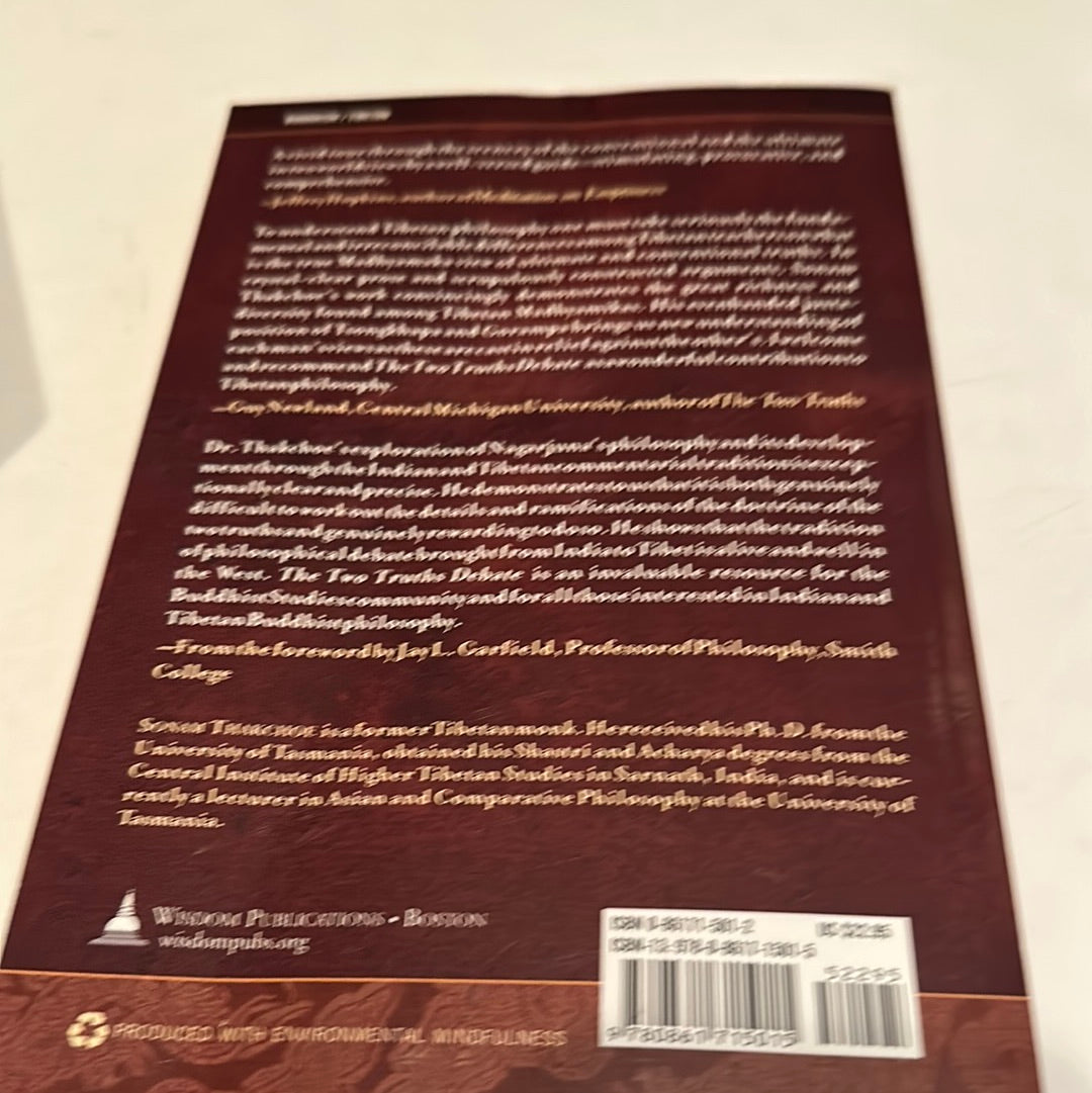 Back cover of a book featuring text about Sonam Thakchoe Two Truths Debate by EveryMailBox