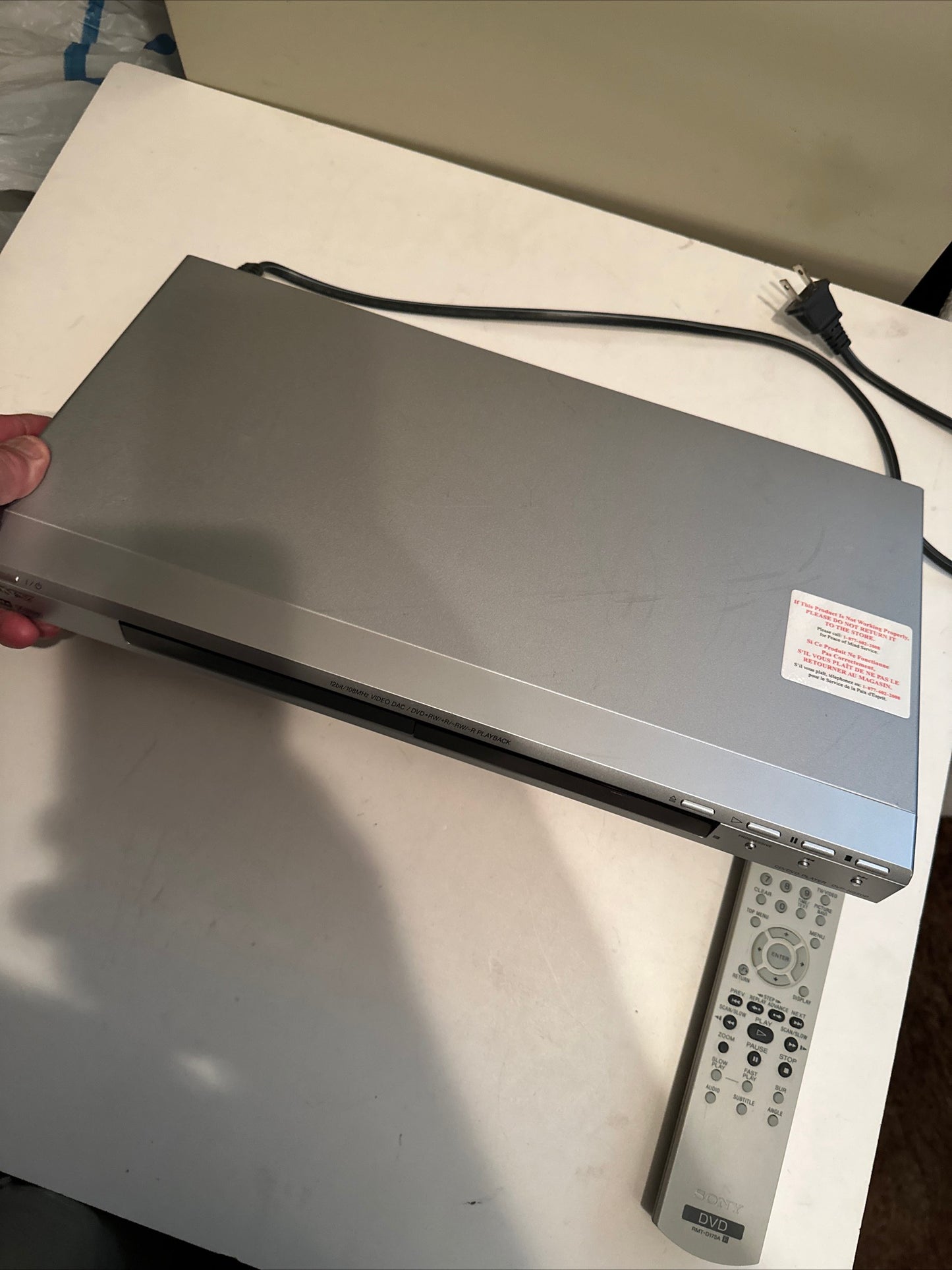 Silver DVD CD player with remote control and power cord available to buy used DVD CD player online