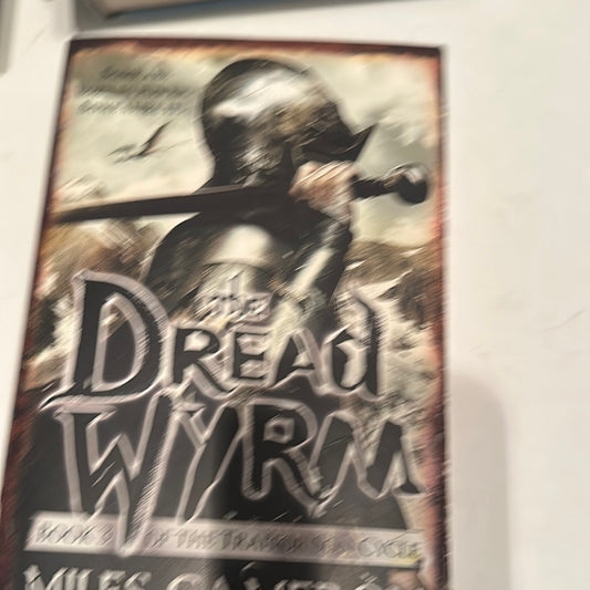 The Dread Wyrm book cover featuring a knight holding a sword with a dark fantasy theme