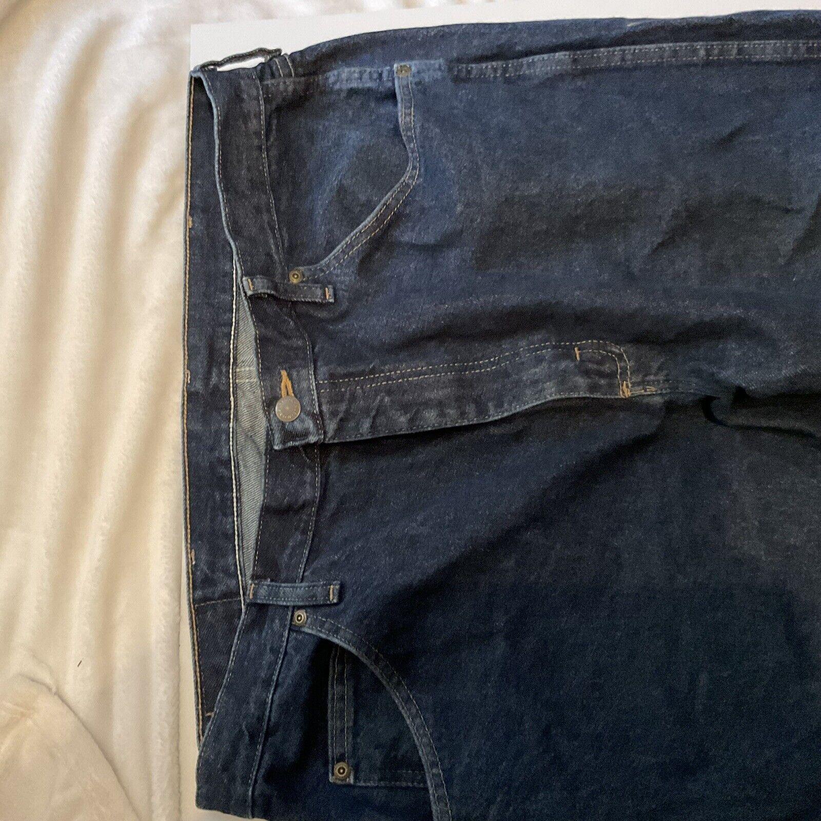 Wrangler relaxed fit jeans men dark indigo front view with button waist belt loops and front pockets