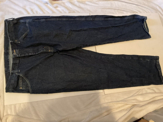 Wrangler relaxed fit jeans men dark indigo straight leg five pocket jeans laid flat on bed